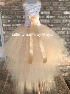 Welcome to Little Dreams by Mayra This dress is just gorgeous! Very fun and puffy! Skirt has four layers of tulle, short in the front and long in the back, very cute and great quality, your little one will love to wear this dress! just perfect to match any party, pictures, Halloween, pageant contest and so on! *If you need a different color or prefer the skirt same length front and back just send me a message my chart is showing the longest Lenght for back of the dress from armpit to toes, and s Cream Tulle Tutu Dress For Baptism, Gold Fitted Princess Dress For Birthday, Cream Tulle Skirt Tutu Dress For Baptism, Cream Princess Dress With Tulle Skirt For Party, Fitted Cream Tutu Dress With Ruffles, Princess Style Cream Tutu Dress With Ruffles, Gold Tulle Tutu Dress For Dress-up, Elegant Tutu Dress With Tulle Skirt For Birthday, Gold Tulle Tutu Dress With Ruffles