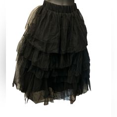 Beautiful Love Me More Layered Tulle Skirt In Black By Chicwish Size Xs/S With Elastic Waistband, Tiered Mesh Fabric Finished -Cool Goth Queen Vibes Are In Order When You Slip Into This Tulle Skirt With Tiered Ruffles. Black Tulle Bottoms With Pleated Skirt, Flowy Black Tulle Skirt, Black Ruffled Petticoat, Black Tiered Tulle Skirt, Elegant Black Tulle Bottoms, Spring Black Lined Petticoat, Black Stretch Tulle Bottoms, Black Summer Petticoat For Costume Party, Black Tulle Bottoms For Evening