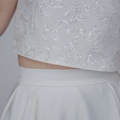 "The elegant and classy \"Aiko\" crop top features sparkly sequined lace mounted onto a matte ivory bridal satin, and it has wide fit cap sleeves, open triangle back and clear buttons. It is only available in shown ivory color. We recommend wearing backless bra with this top. Pair this top with any or our bridal bottoms: https://www.etsy.com/shop/WardrobeByDulcinea?ref=l2-shop-info-name%C2%A7ion_id&section_id=19306135 We would be needing these measurements from you and here are the instructi Bridal Crop Top, Bridal Tops, Backless Bra, Sequin Crop Top, Ivory Bridal, Wedding Top, Wedding Etsy, Ivory Color, Lithuania