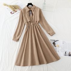 Fall A-line Midi Dress For Office, Casual Beige Office Dress, Elegant Beige Midi Dress For Winter, Chic Beige Long Sleeve Midi Dress, Khaki Dress For Fall, Khaki Fall Dress, Solid Color Khaki Fall Dress, Chic Beige Solid Color Midi Dress, Beige Non-stretch Midi Dress