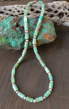 This Navajo turquoise necklace is a classic Native American accessory that you've been searching for. It is handcrafted with beautiful Turquoise beads feature subtle variations of green/blue. This is that boho-chic accessory that will enhance your casual or dressy wardrobe. Measures: 17 1/4" toggle closure Beads vary from 1/4" Weight:15 grams Thank you for shopping with Highway 66 Treasures! 😊 Please note: Most items are vintage. I clean and polish every item I ship due to concerns about germs etc... If you want your purchase left "as is" let me know before shipment. Keep in mind, that means fingerprints etc. In my opinion it's better to polish and if you want the item to tarnish, just leave it on your windowsill for a couple of weeks without wearing. Cheap Turquoise Long Beaded Necklace, Adjustable Southwestern Green Turquoise Necklace, Hand-strung Green Beaded Necklaces Southwestern Style, Southwestern Green Turquoise Necklace, Southwestern Single Strand Green Turquoise Necklace, Southwestern Green Turquoise Necklace With Gemstone Beads, Southwestern Green Single Strand Turquoise Necklace, Real Turquoise Jewelry, Boho Chic Accessories