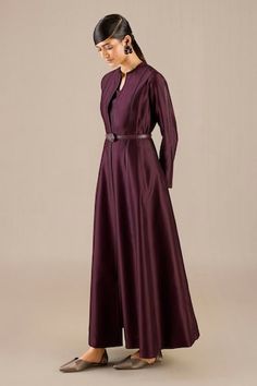 Burgundy jacket gown featuring faux leather trim in the front and sleeves. Paired with a solid inner top and pant, complete with a waist belt., Fit: Relaxed Festive Silk Abaya For Wedding, Silk Abaya For Wedding And Festive Occasions, Elegant Fitted Abaya For Festive Season, Elegant Fitted Abaya For Festive Occasions, Elegant Fitted Festive Abaya, Festive Elegant Fitted Abaya, Festive Evening Fitted Abaya, Elegant Silk Floor-length Abaya, Elegant Long Abaya For Formal Occasions