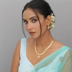 Description: Look classic with this simple and beautiful necklace from Tarinika. This Kundan necklace is a marvelous piece of beauty and will surely accentuate your look in a moment. Style it with any ethnic outfit of your choice and look your elegant best, effortlessly. Details & Specifications: Materials used: Brass Alloy with Matte Gold Platting Weight - Necklace 33 gm, Earrings 8 gm Length - Necklace 14 cm, Earrings 3 cm Make it custom Want to make it a custom Necklace? Sure! Reach out to us Elegant Pearl Necklace With Tilla As A Gift, Elegant Tilla Pearl Necklace Gift, Elegant Chandbali Kundan Necklace Gift, Kundan Necklace With Tilla As A Gift, Elegant Cutdana Pearl Necklace Gift, Elegant Kundan Necklace With Cutdana For Gift, Elegant Chandbali Pearl Necklace For Celebration, Bollywood Style Bridal Necklace With Elegant Design, Bollywood Bridal Necklace With Elegant Design For Festive Occasions