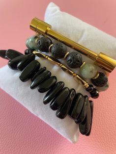 Gemstone Significance: Black Obsidian: Known for its grounding and protective properties, black obsidian helps to shield against negativity and promote emotional balance. Dalmatian Jasper: This unique stone is believed to bring a sense of playfulness and joy, encouraging a positive outlook and a sense of harmony. Versatile Style: The Obsidian & Jasper Bracelet Set is perfect for adding a touch of elegance and sophistication to any outfit. Whether you're dressing up for a special event, adding flair to your everyday look, or seeking a meaningful gift, these bracelets are a versatile and stylish choice. Description: Enhance your jewelry collection with the Obsidian & Jasper Bracelet Set. Handcrafted by skilled artisans, this set features four stunning bracelets made with black obsidian and d Adjustable Black Spiritual Beaded Bracelets, Spiritual Obsidian Bracelets For Healing, Elegant Obsidian Bracelets For Meditation, Adjustable Black Spiritual Bracelet, Obsidian Beaded Bracelets With Natural Stones For Healing, Obsidian 8mm Beads Bracelet For Meditation, Gift Obsidian Beaded Bracelets, Spiritual Black Beads Crystal Bracelet For Healing, Spiritual Obsidian Crystal Bracelet Gift