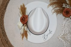 "CURRENTLY ONLY BROWN BAND AVAILABLE  NEW FLOWER COLORS AVAILABLE! 🤍 VEIW OTHER LISTING TO CHANGE HAT COLOR  🤍 Every Bride needs this hat! It's perfect for bridal events including dress shopping, bridal shower, bachelorette, and even your honeymoon! It is boho, fashionable, and unique! 🤍 -adjustable hat -one size fits most people! -breathable, lightweight and comfortable -Material: 65% Cotton, 35% Polyester  -Size:      Hat circumference: 56-58cm/22.22.8\"      Brim width: 7cm/2.75\"     Heig Handmade Wedding Hat With Curved Brim, Custom Adjustable Wedding Hats, Handmade Curved Brim Hat For Wedding, Bohemian Wedding Hat With Adjustable Fit, Bohemian Adjustable Wedding Hat, Adjustable Fedora Straw Hat For Wedding, Adjustable Fedora Mini Hats For Wedding, White Fedora Straw Hat For Wedding, Handmade White Wedding Hat