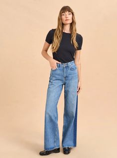 Relaxed and easy, this high rise, wide leg, in non-stretch denim is that favorite jean that you wear on repeat whether with a sneaker or leveling up with a heel. 100% cotton John medium indigo wash Non stretch High rise Wide leg Tan leather patch and belt loop Copper rivets and buttons Fitted at waist with wide, relaxed fit through thigh Machine wash Model is 5'10' and wearing a size 25