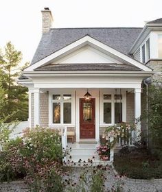 a house with white trim and red door