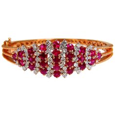 Victorian Ruby Cluster 5.06ct. Natural Ruby Bangle bracelet. Round cut, Fully Faceted. Vibrant Red, excellent Sparkle. Clean Clarity & Transparent. 1.10ct. natural diamonds: Rounds, Full Cut G- color / Vs-2 clarity Secure pressure clasp and safety catch. 24.5 grams. 14kt. rose gold. Measures 7 inches (wearable length) 18.7mm wide. $12,000 Appraisal Certificate to accompany Luxury Red Diamond Jubilee Bracelet, Luxury Red Diamond Bracelet, Red Luxury Diamond Bracelet, Luxury Red Round Gold Bracelet, Luxury Red Diamond Bracelet For Weddings, Luxury Red Diamond Wedding Bracelet, Elegant Red Bangle Gold Bracelet, Luxury Red Diamond Bracelet For Formal Occasions, Elegant Red Gold Bangle Bracelet