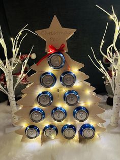 a christmas tree made out of cans and lights