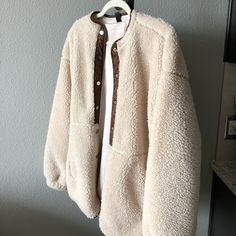 Never Worn Brown Sherpa Outerwear For Cold Weather, Brown Sherpa Outerwear For Fall, Beige Sherpa Outerwear With Faux Fur Lining, Beige Fleece-lined Outerwear For Fall, Beige Outerwear With Fleece Lining For Fall, Beige Sherpa Outerwear For Fall, Cream Fleece Jacket With Pockets For Fall, Cozy Beige Sherpa Fleece Jacket, Cozy Long Sleeve Neutral Outerwear