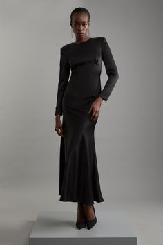 Elevate Your Occasion Wear Wardrobe With Our Elegant Midaxi Dress, With A Fitted Bodice Which Flows Into A Straight Skirt, And A Sleek, Slinky Design Perfect For Re-Wearing To Any Occasion. Style It With Strappy Heels For An Occasion Look That Is Guaranteed To Turn Heads Wherever You Step. Satin Back Crepe Long Sleeved Column Woven Midaxi Dress High Quality, Slinky Satin Backed Crepe Fabric Figure Hugging Fit Bodice Straight Hanging Skirt Long Sleeves High Neckline Keyhole Accent In Back Button Winter Wedding Guest Dresses, Satin Long Sleeve Dress, Wedding Pants, Transitional Fashion, Winter Wedding Guest, Summer Bridesmaid Dresses, Winter Wedding Guest Dress, Spring Wedding Guest Dress, Maxi Dress Collection