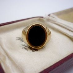 Vintage black onyx and 9k yellow gold signet ring.  In very good condition with light surface wear.  UK Size JP/Q - US Size 8 Hallmarked for 9k gold, Birmingham and stamped with maker's mark D&W. Weighs approx. 4 grams. Your ring will be sent gift wrapped - and boxes used in photos are for display purposes only and not included. Onyx Signet Ring, Signet Rings, Gold Signet Ring, Send Gift, Onyx Ring, Maker's Mark, Signet Ring, Makers Mark, Black Onyx