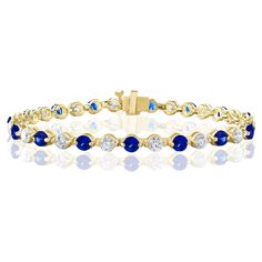 A stunning bracelet set with 18 stunning Blue sapphires weighing 3.18 carat total. Alternating these Blue Sapphires are 18 sparkling round diamonds weighing 2.88 carats in total. Set in polished 14k yellow gold. Double lock mechanism for maximum security. A simple yet dazzling piece. All diamonds are GH color SI1 Clarity. Style is available in different price ranges. Prices are based on your selection. Don't hesitate to get in touch with us for more information. Double Lock, Bracelet Tennis, Blue Sapphire Diamond, Tennis Bracelet, Bracelet Set, Blue Sapphire, Diamond Bracelet, Round Diamonds, Jewelry Bracelets