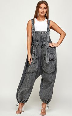 This oversized Bohemian Charcoal jumpsuit is designed with cargo style and numerous pockets for a functional yet stylish look. The pull cord hemline allows for easy adjustments and the machine washable fabric ensures easy maintenance. Perfect for sizes small to 2x. DENIM FABRIC available Instore and online All sales are final No exchange no refunds Baggy Jumpsuits And Rompers With Pockets For Streetwear, Baggy Denim Jumpsuit With Pockets For Streetwear, Baggy Denim Utility Jumpsuit Overalls, Baggy Utility Denim Overalls, Baggy Denim Utility Jumpsuit, Spring Utility Overalls For Streetwear, Baggy Denim Jumpsuit With Pockets For Fall, Baggy Utility Denim Jumpsuit For Spring, Fall Baggy Jumpsuits And Rompers With Pockets