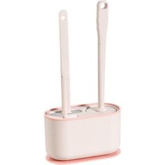 two toothbrushes in a holder on a white surface with pink trimmings