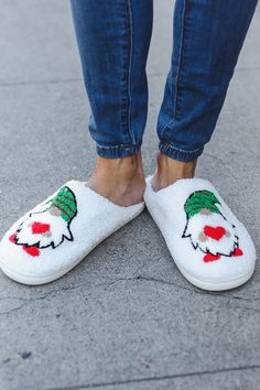 These cozy and sturdy cream fleece holiday slippers come with a striking blush fleece inner lining and a stitched rubber platform. Light weight and sporting a low heel, get ready for the holidays and be prepared to charm with these cute slippers! Sizes: 36/Size 6; 38/Size 7; 40/Size 8; 42/Size 9; 44/10 Slip On Backless Blush inner fleece; Cream outer fleece Fabric content: 65% Polyester 35% Plastic 1-inch stitched rubber heel Fits true to Size Weight: .96 Lbs Imported Fleece Slippers, Holiday Slippers, Cute Slippers, Athleisure Tops, Royal Dresses, Tank Top Long Sleeve, Fall Shopping, Casual Sandals, Christmas Elf