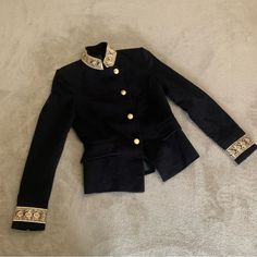 New, Never Used. Velvet Material. Gold Embroidery At Wrists And Neck. About 23” From Shoulder To Hem In Front. About 21” From Shoulder To Hem In Back. Elegant Fall Outerwear With Gold Embroidery, Formal Fitted Outerwear With Gold Embroidery, Elegant Fitted Outerwear With Epaulettes, Fitted Elegant Outerwear With Epaulettes, Fall Fitted Outerwear With Embroidered Cuffs, Fitted Winter Outerwear With Gold Embroidery, Winter Fitted Outerwear With Embroidered Cuffs, Elegant Fitted Outerwear With Gold Embroidery, Designer Embroidered Winter Blazer