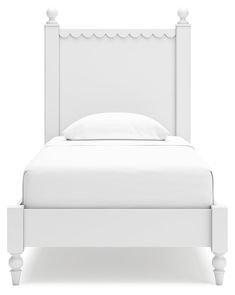 a white bed with an upholstered headboard and foot board on the side