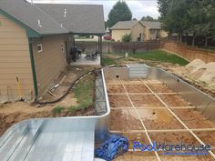 the back yard is being built and ready to be used as an outdoor pool area