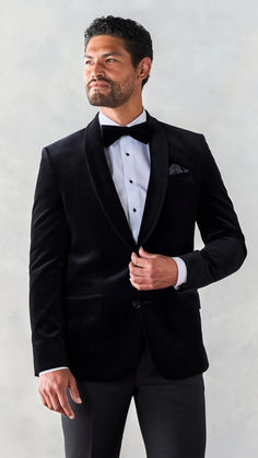 Winter Tuxedo Inspiration- We're really feeling this lightweight velvet jacket tuxedo. With its rich texture and statement-making shawl collar, you're sure to stand out for all the right reasons. Includes jacket and pants. 76% Cotton, 24% Bamboo Two-button closure Shawl collar Side vents Fully canvassed Semi-formal Shawl Collar Winter Outerwear, Party Tuxedo With Shawl Collar And Single Breasted Design, Winter Tuxedo Suits, Tailored Winter Tuxedo For Semi-formal Occasions, Black Formal Outerwear For Holidays, Formal Black Holiday Outerwear, Luxury Winter Tuxedo For Black-tie Events, Luxury Notch Lapel Outerwear For Black-tie Events, Luxury Outerwear For Black-tie Events With Lapel Collar