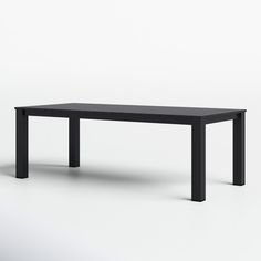 a black table sitting on top of a white floor