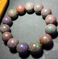 Material:Opal beads size :15mm   quantity: one strand  6mm approx 29 pcs one strands 7mm approx25 pcs one strands 8mm approx 22 pcs one strands 9mm approx 21pcs one strands 10mm approx 19 pcs one strands 11mm approx 18pcs one strands 12mm approx 16 pcs one strands 13mm approx 16 pcs one strands 14mm approx 15 pcs one strands 15mm approx 14pcs one strands 16mm approx 14 pcs one strands 17mm approx 13pcs one strands 18mm approx 13pcs one strands 19mm approx 12pcs one strands 20mm approx 12pcs one strands PLEASE NOTE: 1.Due to lighting effects, monitor's brightness/contrast settings etc, there could be some slight differences in the color tone of the pictures and the actual item. 2.Each piece of natural crystal is unique, the imperfections add natural characters to them. There might be small Opal Gemstone Beads Bracelets, Opal Gemstone Bracelets, Beaded Opal Bracelets, Elegant Opal Beaded Bracelets With Round Beads, Opal Beaded Bracelets With Round Beads, Opal Beaded Bracelets, Iridescent Polished Round Beads Jewelry, Handmade Iridescent Bracelets With Round Beads, Iridescent Jewelry With Polished Round Beads