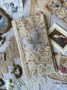 there are many different things on the table together, including laces and paper flowers