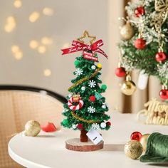 a small christmas tree sitting on top of a table