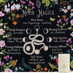 the moon magick sign is on display in front of a black background with flowers