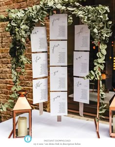 a table with candles and seating cards on it