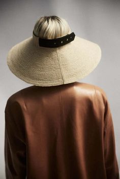 Birdie is an adjustable visor crafted from raffia straw finished with a regenerative black leather closure. this visor can be rolled up for ease of packing.    - partially regenerative    - adjustable back closure    - packable    -  upf 50+    size fit  runs true to size adjustable in back. Women Fedora, Janessa Leone, Birdy, Upf 50, Fedora, Straw, Black Leather, Hats, Like Button