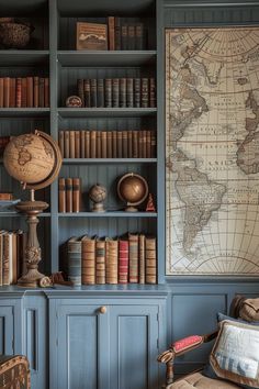 an old world map is mounted on the wall behind a bookshelf