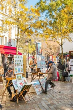 people are painting in an open air area