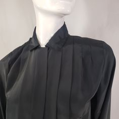 "by Kristin, black blouse with hidden buttons panel and front pleats. Fits Medium 19\" across 23\" long 23\" sleeves * Please review all shop policies before completing transaction. All sales final. No returns or exchanges. * Bundle up for combined shipping. * Instagram @vintagerunsdeepshop" Long Sleeve Pleated Shirt For Work, Pleated Long Sleeve Shirt For Work, Black Long Sleeve Top For Semi-formal Occasions, Elegant Pleated Evening Blouse, Elegant Pleated Blouse For Evening, Spring Black Blouse With Pleated Sleeves, Fitted Black Pleated Tops, Fitted Pleated Tops For Work, Black Blouse With Pleated Sleeves For Spring