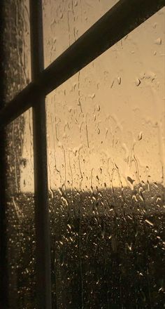 rain drops on the window as it is raining