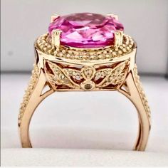 Out Of This World Vivid Pinkovaltopaz Ring Main Stone Carat Weight: 8.21ctw Type: Vivid Pink Topaz-Lab Created Shape: Oval Cut Color: Pink Clarity: Vs Accent Stones: White Topaz Accent Carat Weight: .01ctw Shapes: Round Color: White Clarity: Vvs More Details Total Carat Weight: 9.00ctw North To South: 18.4mm Height Above Finger: 10.2mm Shank Width: 2mm Finger Size: 8 Gram Weight: 7.5g Material: 14k Rose Gold Over 925 Sterling Silver *Retail Value: $499 Luxury Pink Topaz Ring, Luxury Pink Topaz Ring With Diamond, Luxury Pink Oval Diamond Ring, Luxury Pink Oval Topaz Ring, Pink Oval Sapphire Ring With Halo Setting, Luxury Pink Oval Sapphire Ring, Luxury Pink Topaz Ring For Formal Occasions, Luxury Pink Topaz Gemstone Ring, Oval Pink Sapphire Jewelry With Halo Setting