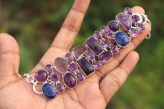 Natural Amethyst and Blue Emerald stone handmade silver plated bracelet |Vintage Amethyst gemstone bracelet| Gift for her on Anniversary. #Mother's Day#handmade jewelry solid Silver 925 with stamp#handmade jewelry#Birthstone #Fastsellin Item #Bestselling #Etsy2022 #StarSeller #Etsypik #Coupoun#Valentine's Day gifts #2022#SilverArtisan #Roynsilverarts #etsy #Shop #SilverArtical #Online #Lowprice stone name -Amethyst and Emerald stone color -Purple and grey, Blue metal plating - silver oxidized ma Bohemian Sterling Silver Crystal Bracelet With Gemstones, Bohemian Sterling Silver Crystal Gemstone Bracelet, Bohemian Sterling Silver Bracelet With Gemstones, Bohemian Sterling Silver Bracelet With Gemstone For Gift, Bohemian Sterling Silver Gemstone Bracelet Gift, Handmade Blue Amethyst Bracelets, Handmade Sterling Silver Healing Bracelet, Handmade Adjustable Amethyst Sterling Silver Bracelet, Silver Amethyst Bracelets With Stones