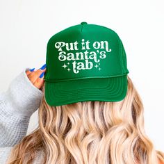 Add a playful and festive touch to your holiday outfits with this trendy trucker hat! Featuring the cheeky phrase "Put it on Santa's Tab," this hat is perfect for spreading holiday cheer while staying stylish and comfortable. Available in Classic Black/White and Festive Green, it's an easy way to accessorize for the season. Details: -Material: High-quality foam front with breathable mesh back -Design: Bold screen-printed graphic with a fun vintage vibe -Fit: Adjustable snapback closure for a perfect fit -Occasion: Perfect for holiday parties, Christmas shopping, family photos, or casual outings Features: -Lightweight and breathable material -Adjustable fit for all-day comfort -Durable print that won't fade with wear Perfect for: -Christmas events and parties -Gifting to friends or family - Funny Trucker Hat, Trendy Hat, Christmas Events, Hat For Women, Vintage Vibe, Gifts For Adults, Christmas Season, Christmas Seasons, Christmas Shopping