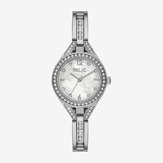 Add a feminine touch to your look with this Relic by Fossil evalyn three-hand silver-tone watch. It features a 27mm round case with a white mother of pearl dial and a jewelry bracelet with square shaped stones.Number of Batteries: 1Included: 1 Watch(es)Features: Quick ShipBattery Type: Lithium IonJewelry Closure: Fold Over ClaspPower Source: Battery (included)Watch Movement: QuartzWater Resistance: 30mBand Color: Silver ToneDial Color: Mother of PearlMetal Color: Silver ToneCase Thickness: 8mmCa Three Hands, Jewelry Bracelet, Watch Movement, Watch It, Jewellery And Watches, Mother Of Pearl, Fossil, Bracelet Watch, Silver Tone