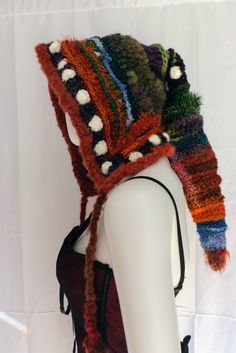 Super warm and unique Crochet Elf Hood in purples, greens, browns and white with a deep wide brim. Created from reclaimed yarns of wool, alpaca & specialty fibersOne Size   1 of 1 Bohemian Knitted Hat For Fall, Bohemian Knitted Fall Hat, Winter Bohemian Yarn Hat, Bohemian Yarn Hats For Winter, Multicolor Wool Hat For Fall, Warm Bohemian Hat For Fall, Handmade Alpaca Hats For Fall, Bohemian Hand Knitted Bonnet For Winter, Bohemian Knitted Alpaca Hat