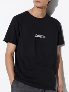 Elevate your streetwear collection with our Chic Serif Designer T-Shirt. This minimalist yet stylish tee is perfect for artists, designers, and fashion enthusiasts who appreciate a blend of simplicity and elegance. Featuring the word "Designer" in a sophisticated serif font, this tee embodies a clean and modern aesthetic. The classic typography adds a touch of refinement to your streetwear look, making it a versatile piece for any wardrobe. Crafted from premium, soft cotton, this t-shirt ensures Modern Cotton T-shirt With Logo Print, Modern Crew Neck T-shirt With Text Print, Modern Screen Print T-shirt For Streetwear, Modern Branded T-shirt For Streetwear, Modern Text Print Relaxed Fit Tops, Modern Relaxed Fit Tops With Text Print, Modern Short Sleeve Top With Logo Print, Modern Relaxed Fit Short Sleeve T-shirt, Modern Short Sleeve Streetwear T-shirt