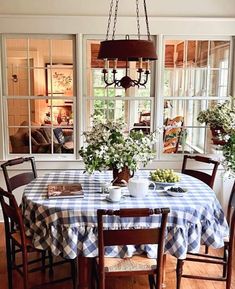 a dining room table with blue and white checkered cloth