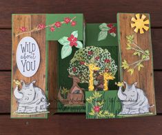 an open book with animals and flowers on the pages, which reads wild about you