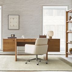 a white chair sitting in front of a desk with a book shelf on top of it