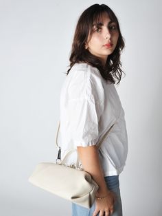 The baguette bag is a charming framed ladies bag. softly structured in a supple leather and lightweight it has a snap top closure and a detachable adjustable strap which allows for multiple carry options.    • handmade in utrecht the netherlands  • 14"l x 6"h x 5"d - unlined  • detachable adjustable shoulder strap 38" - smoke hardware  • 3.5" handles  • single snap top frame closure.  2 small drop down pockets on either side of the bag  • exclusive to roztayger in the us On-the-go Baguette Bag With Top Handle And Detachable Handle, Timeless Everyday Shoulder Bag With Rolled Handles, Minimalist Crossbody Satchel With Detachable Strap, Everyday Timeless Shoulder Bag With Rolled Handles, Timeless Everyday Bags With Rolled Handles, Versatile Baguette Clutch With Adjustable Strap, Versatile Clutch Box Bag With Detachable Strap, Versatile Everyday Clutch Flap Bag, Everyday Shoulder Bag With Detachable Strap And Top Handle