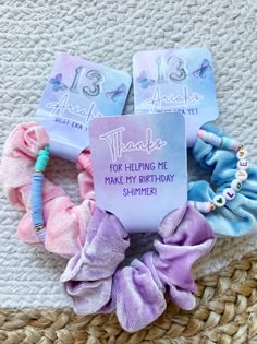 some hair accessories are laying out on a woven mat with the words thank you for helping me make my birthday shimpie