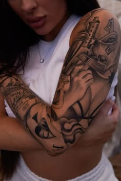 a woman with a tattoo on her arm