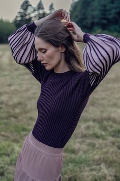 Elevate your winter wardrobe with our Balloon Sleeve Sweater-Maroon/Pink. The unique balloon sleeves add a playful touch to this cozy sweater, while keeping you stylishly warm.