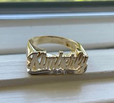 Medium Size Personalized Name Ring In Real 10K & 14K Gold *FLAT FACE * MADE IN USA (HAND MADE ITEM) Make the names of your family, friends and love ones into rings for their gift. It's great as an everyday necklace and makes an awesome gift! This Item is 100% customization especially for you. Item Description *Material: Real Gold *Type: *FLAT FACE* ( Like photo) with Heart Tail with Bit Work *Ring size: ring sizes between 1-11 (including half sizes) *Size of Ring : 20mm*8mm *Script Design *O Yellow Gold Engraved Promise Ring With Name, Classic Yellow Gold Engraved Ring With Custom Name, Yellow Gold Promise Ring With Engraving, Gold Nameplate Engraved Ring For Anniversary, Gold Engraved Nameplate Ring For Anniversary, Personalized Nameplate Ring For Anniversary, Custom Name Engraved Yellow Gold Promise Ring, 14k Gold Nameplate Ring For Anniversary, 14k Gold Engraved Ring For Promise With Names