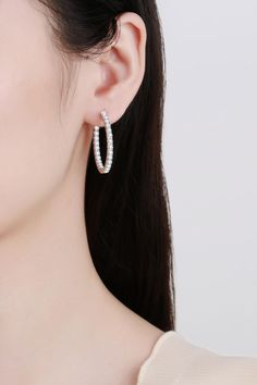 Our Rhodium-Plated Hoop Earrings are a must-have staple to your jewelry collection. Made with 925 sterling silver and moissanite, this style makes an elegant gesture to any outfit. Picture style: Ghost mannequin Style: Modern, minimalist Appearance: Round Material: 925 sterling silver, moissanite, rhodium-plated Craft: Polished Care: Avoid wearing during exercise, as sweat will react with the jewelry to produce silver chloride and copper sulfide. Imported Including: A matching boxNo certificate Silver Diamond Single Hoop Earring, Modern Sterling Silver Hoop Earrings With Prong Setting, Fine Jewelry Cubic Zirconia Hoop Earrings With Halo Design, Sterling Silver Round Cut Hoop Earrings With Halo Design, Silver Hoop Earrings With Halo Design, Cubic Zirconia Halo Hoop Earrings, Cubic Zirconia Round Hoop Earrings, Sterling Silver Hoop Earrings With Halo Design, White Gold Cubic Zirconia Hoop Earrings For Pierced Ears